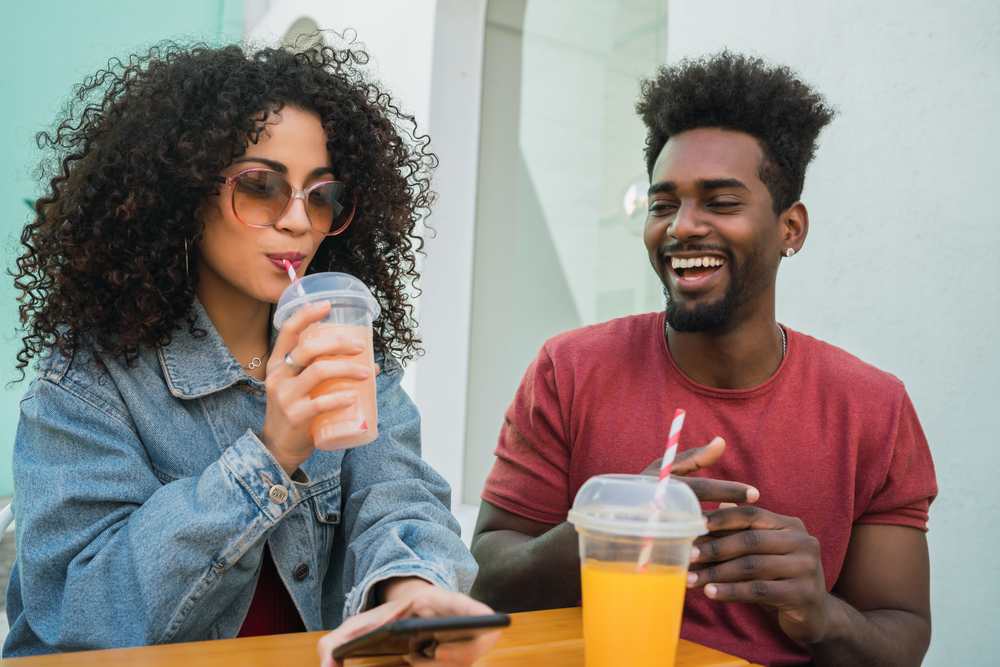 Young couple with smoothies